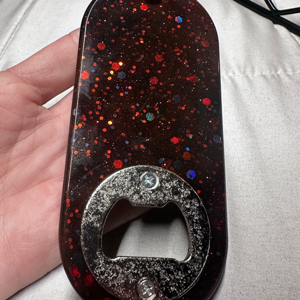 Metallic Black, silver and red keychain bottle opener